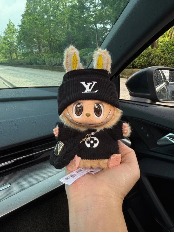 labubu is wearing a black lv sweater