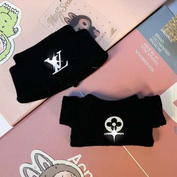 labubu is wearing a black lv sweater